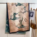 Detailed view of ethnic wool shawl with vintage deer patterns and delicate tassels - 190x65cm / Nine-Colored Deer
