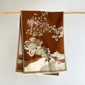 Detail of winter cashmere shawl featuring vintage Chinese floral patterns and soft fringes - Coffee