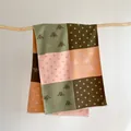 Detailed shot of cashmere-like scarf featuring bee prints, color blocks, and fringe edges - 185x65cm / Pink and Green