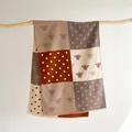 Detail of bee embroidery and polka dots on cashmere-feel color-block winter shawl - 185x65cm / Gray