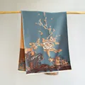 Detailed view of cashmere-feel scarf featuring vintage orange peonies and landscape patterns - Light Blue
