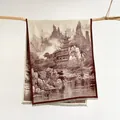 Dettaglio di sciarpa vintage con paesaggio cinese e nappe su un ramo di legno - caffè