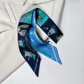 Elegant skinny silk scarf with blue geometric prints on a stylish cream blazer background - Keys and Locks Pattern / Black