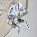Elegant long skinny scarf with hand-painted handbag and key patterns on a beige suit - Handbag and Lock Elements / White