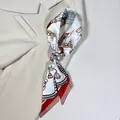Detail of floral silk scarf featuring equestrian chain patterns and red striped borders - White Coffee Equestrian Style (PD2536—4)