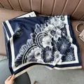 Detailed view of thick cashmere scarf with floral fan pattern and fine tassels - Court Flower Blue