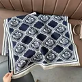 Detail of French style jacquard scarf with blue floral pattern and fringe edge - Arranged Flower Blue