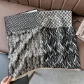 Elegant black and white patchwork cashmere-like shawl with tassels and mixed geometric patterns - Patchwork Black