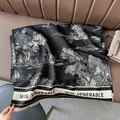 Close-up of black and white landscape print cashmere scarf with tassel edges - Black Landscape Art