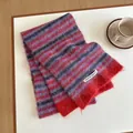 Detail of multi-colored striped wool scarf texture with brand label on minimalist background - 170x27cm / Red Purple Gray Multicolor