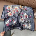 Detail view of oil painting style scarf featuring vintage white plum blossoms and tassels - Blue