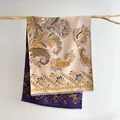 Detailed close-up of double-sided paisley jacquard shawl with fine tassel edge on wood - Paisley (Blue And Yellow) / Blue-Yellow
