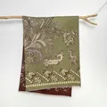 Close-up of bohemian paisley jacquard shawl with double-sided olive green and brown tones - Paisley (Green) / Green