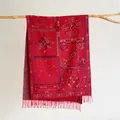 Bohemian retro red shawl with colorful paisley patterns and tassels on a wooden hanger - Red