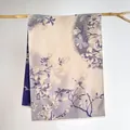 Detail of elegant magnolia jacquard pattern and fringe on beige pashmina scarf - Magnolia Light Blue