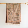 Close-up of Bohemian pashmina scarf with paisley pattern, fringe details and ethnic jacquard - Dark Khaki