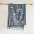 Close-up of vintage cashmere-like scarf with floral rose patterns and fringe detail - Gray