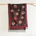 Detailed view of rose floral embroidery and black tassel fringe on vintage cashmere scarf - Black Coffee