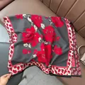 Macro detail of vintage floral jacquard shawl with gray and red leopard print borders - Leopard Edge Floral - Gray