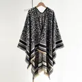 Elegant leopard print knit shawl cape with fringe hem for winter, black and white pattern - Black