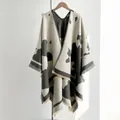 Women's warm shawl poncho with stylish black and white cow pattern and fringe details - One Size / Gray
