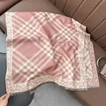 Detail of pink plaid scarf featuring leopard print jacquard edges and fine fringe trim - 180x65cm / Pink