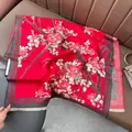 Detail of red cashmere pashmina shawl featuring plum blossom prints and white tassels - 180x65cm / Red