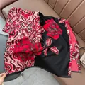 Retro vintage paisley scarf with red rose pattern and tassels on leather background - Patchwork Floral - Black