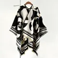 Elegant black and white camellia knit poncho wrap with fringed hem for women - Black