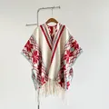 Detail of bohemian knit shawl featuring red snowflake patterns and fringe tassels - 170x110cm / Beige Red