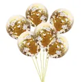 Detail of 6 clear balloons filled with golden round confetti and tied with gold ribbons - Standard / Gold Sequin