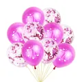 Close-up of pink and confetti 1st Birthday party balloons with white printed patterns - Magenta Balloons with Magenta Confetti