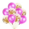Close-up of 1st Birthday balloons with rose red latex and gold confetti accents - Magenta Balloons with Gold Confetti