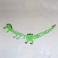Green dinosaur Happy Birthday banner party decoration hanging on a white brick wall - New Green Dinosaur with Black Claws