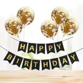 Detail of Happy Birthday banner and five gold confetti latex balloons on a wooden table - Black Gilded Banner + 5 Gold Sequin Balloons