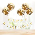 Golden confetti balloons with Happy Birthday banner set on light wooden surface - White Gilded Banner + 5 Gold Sequin Balloons
