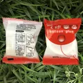 Transparent double-sided balloon glue dots for party decoration on a green grass background - Standard Type