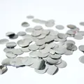 Shiny silver round confetti sequins for balloon filling and party decoration on white background - Silver