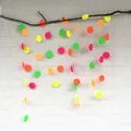 Neon paper circle garland with fluorescent green pink and orange hanging discs for parties - Neon Circle Style