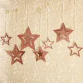 Set of 7 rose gold hollow star ornaments with glitter finish for festive party decor - Rose Gold