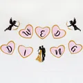 Pink heart wedding banner with gold glitter edges and black Cupid angel decorations - Heart Wedding Decorations