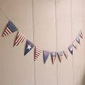 Detail of USA Independence Day bunting banner with red, white, and blue star patterns - American Shield Style Triangle Banner / Red White Blue