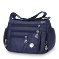 Bolso bandolera de tela Oxford azul oscuro con acolchado de rombos y varias cremalleras - Azul