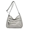 Borsa a tracolla grigia in pelle lavata con cerniere multiple e applique a cuore - Grigio chiaro