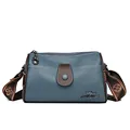 Blue lychee leather Boston crossbody bag with brown trim and floral jacquard strap - Blue