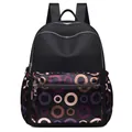 Women's black backpack featuring colorful geometric circle patterns and multiple compartments - Purple Circles