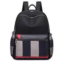 Black travel backpack with multi-compartments and red/grey/blue striped pattern detail - Plaid