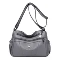 Dark grey soft leather crossbody bag with multiple zipper compartments and metal logo - Gray