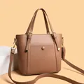 Brown lychee leather tote bag with gold round buckle and adjustable shoulder strap - Brown