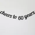 Detail of black Cheers to 60 Years banner for birthday and anniversary party wall decor - 60 Years Style / Black